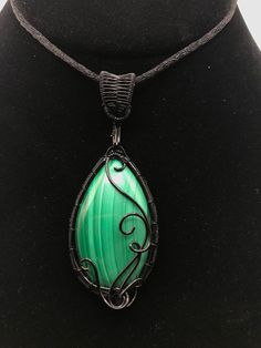 ~ITEM~ Natural Malachite stone wire wrapped in black wire. Pendants come on a 9inch black cord. Chains can be added upon request for an additional fee. Please message me if you are interested. Most of my items are handmade and one of a kind. However, if an item is sold out I can always attempt to recreate something. Feel free to message me regarding custom orders ~MADE TO ORDER ITEMS~ Please note that there are 2-3 days extra shipping time on items that are made to order. Please also know that handmaid made to order means that no 2 of the same items are identical. However, I try and get as close as I can when making items! :) Wire Pendants, Wire Wrapped Stone Jewelry, Wire Wrapped Jewelry Tutorials, Malachite Necklace, Wire Wrap Jewelry, Malachite Pendant, Wire Wrap Pendant, Malachite Jewelry, Wire Wrapping Stones