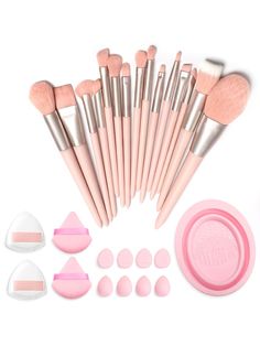 the makeup brushes and powders are laid out on a white surface