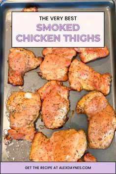 the very best smoked chicken thighs on a baking sheet with text overlay that reads, the very best smoked chicken thighs