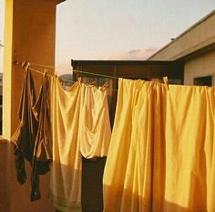 clothes hanging out to dry outside on a sunny day with blue sky in the background