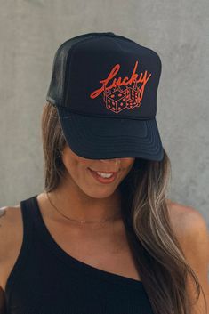 Inspired by VEGAS baby, our Lucky Roll trucker hat features hand drawn lettering and dice illustration. We love Vegas for food, occasional luck at the tables, pool days and visits to grandma! This black trucker hat features an adjustable snapback, mesh backing and foam front! Size: One size fits most Material: 100% Polyester Made in Myanmar + USA Designed in Ventura, CA Black Trucker Hat With Letter Print And Flat Bill, Black Snapback Trucker Hat With Letter Print, Black Letter Print Snapback Trucker Hat, Adjustable Black Trucker Hat With Letter Print, Black 5-panel Hat With Letter Print, Adjustable Black Baseball Cap With Graphic Print, Trendy Black Trucker Hat As Gift, Black 5-panel Snapback Hat With Letter Print, Black 5-panel Baseball Cap With Letter Print