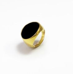 Dramatic gold plated signet ring with hand painted black enamel, its a modern and urban piece that is wearable by any woman or man. The ring is made of high quality nickel-free thick layer 24K gold plating over a brass base, it has a dazzling high polish finish with clean lines by the highest standard and materials. show off your exceptional style when you wear this large enamel ring, this showy piece is certainly a grand fashion statement.Customization:• You can order this ring in different sha Modern Enamel Rings For Formal Occasions, Modern Oval Black Enamel Rings, Gold Rings With Black Enamel For Gifts, Modern Enamel Open Ring With Polished Finish, Modern Polished Enamel Open Ring, Modern Polished Finish Open Enamel Ring, Gold Enamel Ring With Black Detail For Formal Occasions, Modern Black Enamel Ring Jewelry, Luxury Black Engraved Promise Ring