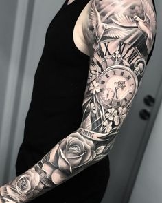 a man with a clock and roses tattoo on his arm