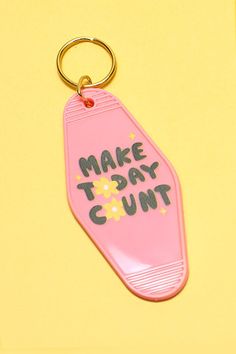 a pink keychain with the words make today count written on it