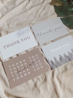 four thank you cards with the words thank you written on them, along with a plant