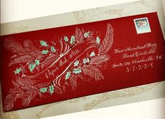 a red envelope with green and white designs on it