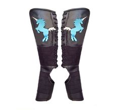 a pair of black boots with blue horses on them