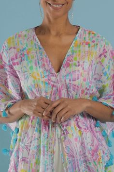 Stylish and easy to wear coverup. A playful flower print with purples and pops of lime on white. Turquoise tassels. Drawstring waist. This elegant and modern caftan works as beachwear, loungewear, or layered over a camisole for a casual look. Tie it open for a kimono style. White Turquoise, Kimono Style, Kimono Fashion, Flower Print, Palm Beach, Flower Prints, Drawstring Waist, Casual Looks, Tassels