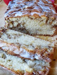 a loaf of cinnamon swirl bread sitting on top of a cutting board