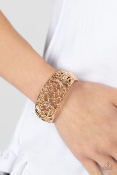 Glistening gold vine-like filigree enchantingly twines across the centers of two airy gold frames that delicately hinged into a bangle-like bracelet, resulting in a regal centerpiece. Features a hinged closure. Sold as one individual bracelet. Elegant Metal Bracelets With Intricate Design, Elegant Gold Plated Bracelets With Intricate Design, Elegant Bangle With Intricate Design, Elegant Gold-tone Jewelry With Filigree, Elegant Gold-tone Jewelry With Intricate Design, Elegant Cuff Bracelet With Intricate Design For Formal Occasions, Elegant Cuff Bracelet With Intricate Design For Formal Events, Hinged Cuff Bracelet For Formal Occasions, Elegant Hinged Gold Bracelet As Gift