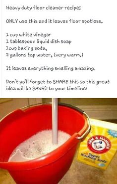 a red bucket filled with white liquid next to a box of salt and a spoon