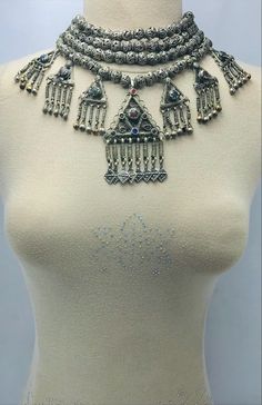 *The silver tribal necklace is one of the most engaging jewelry pieces we have in our collection. This semi-silver tribal necklace is one of the most adored pieces in our collection. The pendants and silver drooping tassels with antique designs and glass stones. Above all the beaded multilayers make this tribal piece a worth admiring piece for our consumers. *Made up of the best quality of metal alloy this multilayer choker necklace takes us back to ancient times. The antiquity and grace of this Beaded Jewelry For Rituals And Festivals, Bohemian Necklaces With Intricate Design For Festivals, Traditional One-of-a-kind Necklace For Festival, Silver Bohemian Necklace For Festivals, Bohemian Silver Necklace For Festival, Bohemian Antique Silver Jewelry For Festivals, Antique Silver Bohemian Jewelry For Festivals, Silver Jewelry With Jewels For Festivals, Bohemian Silver Beads Necklaces For Rituals