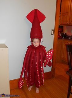 a young boy dressed in an octopus costume