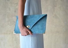 Soft Symmetria Clutch in jeans blue.The perfect bag for all occasions!Ideal for cocktail and parties or for business meetings depending the size you choose. It comes in two sizes, small and large.You can use it as a chic briefcase for your work or as a modern large clutch for a night out.This adorable large clutch is handmade out of a genuine, lux Italian jeans blue suede leather.-Small size fits all your essentials, wallet, keys, mobile, cosmetics etc. -Large size fits a 15" laptop, ipad, porto Luxury Green Clutch With Detachable Strap, Soft Leather Rectangular Clutch For Party, Green Leather Rectangular Clutch, Green Rectangular Leather Clutch, Green Leather Clutch For Evening, Green Leather Evening Clutch, Chic Green Leather Clutch, Chic Green Pouch Evening Bag, Chic Green Envelope Bag