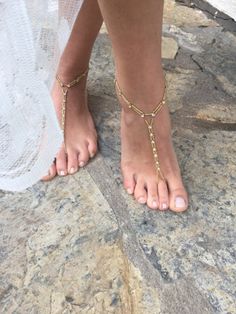 Wedding Barefoot Sandals Add a touch of elegance to your beach wedding with these beautiful handmade barefoot sandals. The anklet design features  beads, and rhinestones, making it perfect for the bride or bridesmaids. The pearls are delicately strung together, creating a charming and romantic look. These sandals are personalized with your choice of size and are suitable for your parties.  this anklet is a unique addition to any jewelry collection. You can take a look at my other products. If you have any questions about custom design or any other questions, please send me a message. Thank you for your visit. I wish you happiness Elegant Adjustable Barefoot Sandals For Beach, Gold Beaded Bohemian Barefoot Sandals, Gold Bohemian Sandals For Wedding, Gold Ankle Strap Barefoot Sandals For Beach, Adjustable Gold Barefoot Sandals For Beach, Adjustable Beaded Barefoot Sandals For Beach Wedding, Bohemian Adjustable Anklets For Destination Wedding, Beaded Toe Ring Jewelry For Beach Wedding, Bohemian Toe Ring Jewelry For Destination Wedding