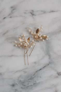 Mya Hair Pin Delicate leaves, shimmering pearls and crystal gems adorn these beautiful hair pins. These bridal hair pins look elegant when styled on their own, or pair them together to create an ethereal bridal headpiece.  Available in Gold and Silver.  Decorative portion of the hairpin is approximately 2" wide and 2" tall.  Price is for a set of two hairpins. SHIPPING: This item is handmade to order. Please see the Shipping & Policies section for production time. If you need your item sooner, p Gold Hairpiece, Gold Leaf Hair, Pearl Wedding Hair, Gold Hair Piece, Pearl Bridal Hair, Bridal Hair Pins Pearl, Bridal Hair Pin, Wedding Hair Comb, Rose Gold Bridal