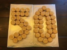 there are two trays that have some cookies on top of them, and one has the letter e in it