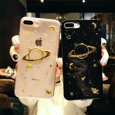 two cases with gold stars and planets on them