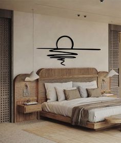 a bedroom with a large bed and wall decal