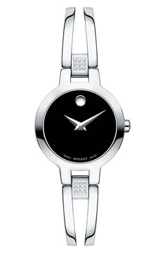 An entrancing black dial sets the elegant tone of a dainty polished watch featuring an accurate, finely crafted Swiss movement, concave titanium Museum dot and pavé diamonds on the bangle hinges. Style Name:Movado Amorosa Diamond Bangle Watch, 24mm. Style Number: 5500194. Available in stores. Gents Bracelet, Silver Watches, Black Museum, Movado Watch, Swiss Made Watches, Bangle Watches, Stainless Steel Bangles, Jewelry Clasps, Bangles Style