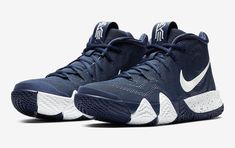 the nike kd trey basketball shoe is shown in navy blue and white, with an upper