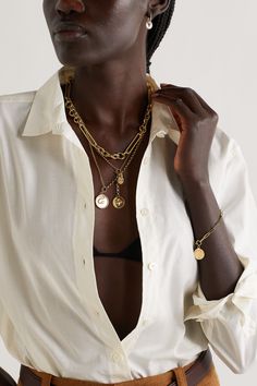 The snake on Foundrae's necklace holds so much meaning - it represents wholeness and is known as a "talisman of rejuvenation - they shed their skin to grow, just as we need continued growth to find balance." It's handmade from 18-karat gold and inlaid with glossy white enamel and a single diamond. Wear it layered with other symbolic styles from the brand. Luxury Brass Necklace With Detachable Pendant, Luxury Gold Plated Tarnish Resistant Coin Necklace, Luxury Gold-plated Tarnish-resistant Coin Necklace, Luxury Tarnish Resistant Gold Plated Coin Necklace, Luxury Tarnish-resistant Gold-plated Coin Necklace, Luxury Tarnish-resistant Coin Pendant Necklace, Luxury Tarnish-resistant Pendant Coin Necklace, Luxury Chain Necklace With Detachable Pendant, Luxury Gold-tone Necklace With Detachable Pendant