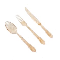 three forks and two spoons are on a white surface with gold flecking