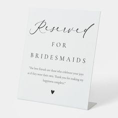 a white card with the words reserved for bridesmaids