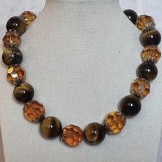 Necklace made with large tiger eye beads and faceted glass beads. The tiger eye beads are a beautiful golden brown color with a chatoyant effect, while the glass beads add sparkle and shine.  Stunning necklace in good condition Quite a heavy piece. General Info AshleyParkerVA All the items I sell have been used before and now need a new home.  They are perfect with imperfections, and I will point out the specific condition each time.  Dispatch times are 3-5 days - if you need something super qui Cheap Brown Beaded Costume Jewelry Necklaces, Luxury Amber Beaded Necklace With Large Beads, Luxury Amber Beaded Necklaces With Large Beads, Luxury Brown Beaded Necklaces, Luxury Amber Oval Beaded Necklace, Luxury Brown Oval Beaded Necklace, Luxury Amber Beaded Necklaces With Oval Beads, Luxury Amber Beaded Necklaces With Faceted Beads, Cheap Brown Beaded Costume Jewelry Necklace