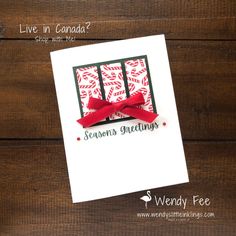 a handmade christmas card with a red bow on it and the words season's greeting