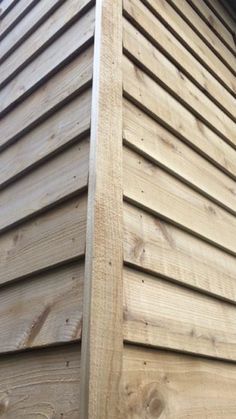 the side of a house with wood siding