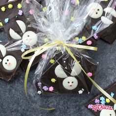 some chocolate treats are wrapped in plastic and have bunny faces on them