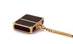 "Brand: Louis Vuitton Hallmark: Louis Vuitton Made in Italy Material: yellow gold finish metal Measurement: suitcase: 1.76\" tall x 1.77\" long x 0.43\" high Keyring Chain: 4\" long Weight: 105.4 grams This is an adorable Alzer Bag charm from Louis Vuitton, it has the famous brown color monogram logo small suitcase charm with yellow gold finish. The case opens to reveal a silver finish mirror inside. comes with a large round spring ring and a long bar tag hallmarked with the designer name. 23250 Luxury Bags With Logo Charm For Gift, Luxury Formal Bags With Logo Charm, Yellow Gold Rectangular Travel Bag, Designer Gold Bag With Logo Charm, Designer Gold Bags With Logo Charm, Luxury Brown Engraved Bags, Beautiful Rings Vintage, Small Suitcase, Designer Name