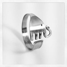 a silver ring with the word ms on it