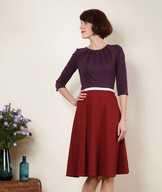 "Simple elegance! A beautiful spring dress is made of thicker knit fabric with a wide skirt and 7/8 sleeves. Especially nice is the pleated neckline. The bodice in violet is form-fitting and the skirt in bordeaux swings at each movement of the loose-fitting form. With a waist stripe in offwhite. Size / Weight / Length: variable from 90-110 cm (100 cm in the photo) \"Lucy\" is available in sizes 36-44. materials Viscose, Spandex Care instructions: Wash at 30 degrees, iron hot from left Production Fall Dress With Pleated Waist And Full Skirt, Stretch Full Skirt Dress With Gathered Details, Long Sleeve Flowy Dress With Gathered Skirt, Stretch Pleated Skirt Dress, Long Sleeve Gathered Skirt Fall Dress, Fall Dresses With Gathered Full Skirt, Fall Dresses With Full Gathered Skirt, Long Sleeve Dress With Gathered Skirt For Fall, Stretch Pleated Skirt Dress For Fall