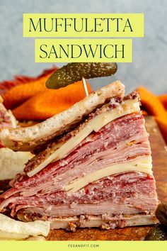 A muffuletta sandwich topped with a sweet pickle. Muffuletta Sandwich, Gluten Free Flatbread, Pickled Cauliflower, Pork Casserole, Olive Tapenade, Deli Meats, How To Make Sandwich, Prepped Lunches