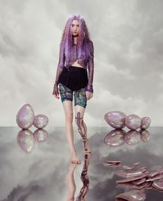 a woman with purple hair is standing in front of an artistic background, and the caption reads instagram