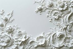 an intricate white wallpaper with flowers and leaves