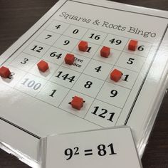 a table with some red dices and numbers on it