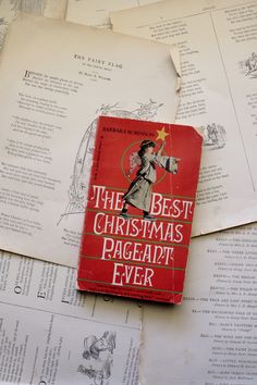 the best christmas pageant ever book laying on top of old paper