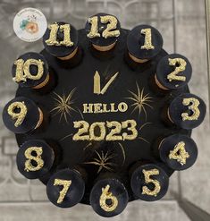 a black and gold clock with numbers on it