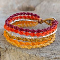 Shimmering beads of silver harmonize with shades of orange yellow red and brown in the design of this wristband bracelet. Thailand's Napapat crafts her design by hand with macrame techniques resulting in a bracelet of wondrous allure. .950 Silver String Bracelet Patterns, Friendship Bracelets Tutorial, Bracelets Handmade Diy, Bracelets Design, Diy Bracelets Patterns, Wristband Bracelet, Silver Bead Necklace, Friendship Bracelets Diy, Crochet Bracelet