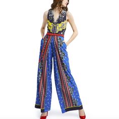 Fits True To Size, Take Your Normal Size O V-Neck O Sleeveless O Tie Waist O Exposed Back Zipper Closure O 100% Polyester Est. Retail Price: $595.00 Chic Blue V-neck Pantsuit, Chic Blue Wide-leg Jumpsuits And Rompers, Chic Blue Wide Leg Jumpsuits And Rompers, Sleeveless Blue Pantsuit For Summer, Chic Multicolor Jumpsuits And Rompers, Chic Multicolor Workwear Jumpsuits And Rompers, Chic Multicolor Jumpsuits And Rompers For Work, Black Strapless Jumpsuit, Jumpsuit With Belt