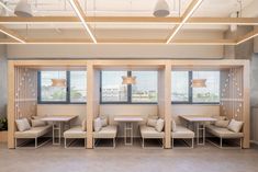 an empty waiting room with chairs and tables