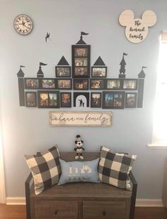 a bench with pillows and pictures on the wall