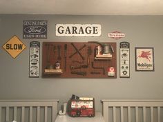 there is a garage sign and tools on the wall in this child's room