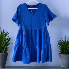 Fancyinn Ruffle Tiered Swing Shirt Dress Blue Size Xs Blue V-neck Tiered Dress With Ruffle Hem, Blue Cotton Dress With Ruffle Sleeves, Blue Mini Dress With Ruffle Hem For Brunch, Blue Cotton Mini Dress With Ruffles, Blue Cotton Tiered Dress With Ruffle Hem, Casual Fitted Blue Tiered Dress, Blue Mini Dress With Ruffle Hem For Day Out, Blue Cotton Dress With Ruffle Hem, Casual Blue Mini Dress With Flutter Sleeves