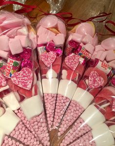 pink and white candies in cellophane bags