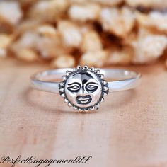 Celestial Sun Face Ring | Solid 925 Sterling Silver Sun Ring | Womens Silver Ring | Fashion Trendy Ring | Women's Gift * Height: 8mm * Solid 925 Sterling Silver * Ring box included Processing and Shipping Details Ready to ship within 1-2 business days. USPS First Class mail is used for standard shipping. A tracking number is provided via email when the package is shipped. Faster shipping option is available.  Maintenance  Cleaning/Polishing - It is recommended to use a jewelry polishing cloth to Nickel-free Sterling Silver Celestial Rings, Symbolic Sterling Silver Ring With Sun And Moon Design, Sterling Silver Sun And Moon Promise Ring, Sterling Silver Rings With Sun And Moon Design, Celestial Sterling Silver Midi Rings As Gift, Celestial Sterling Silver Midi Rings For Gift, Celestial Style Sterling Silver Midi Rings For Gift, Adjustable Celestial Sterling Silver Stackable Rings, Sterling Silver Celestial Midi Rings