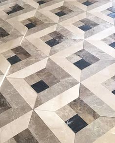 a marble floor with black and white squares on it